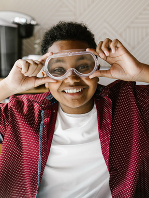 kid wears goggles to avoid flu