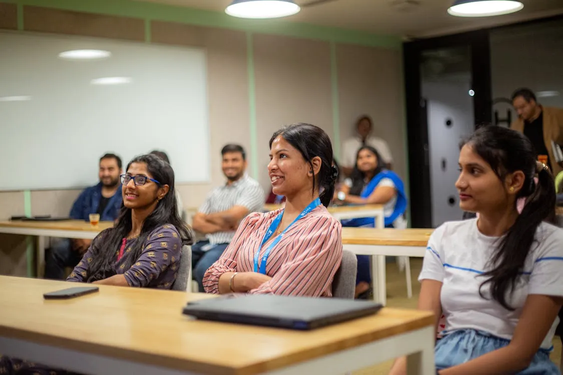 A group of people in a meeting