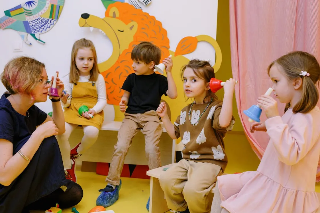 Children holding various types of bells