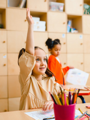 child raises hand at daycare