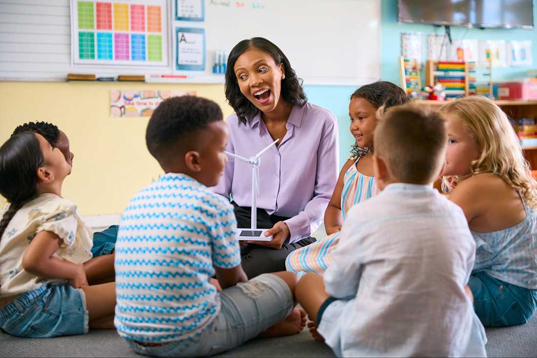 Teacher sharing a story with students to build connections.